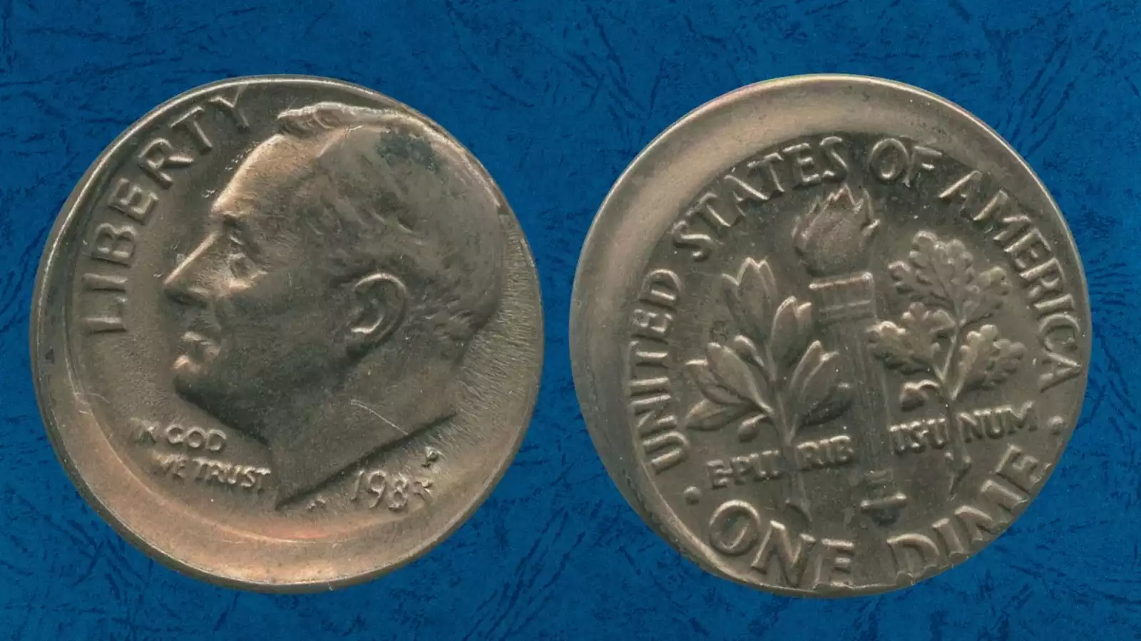 1983 Roosevelt dime with off-center strike error showing partial design and blank planchet crescent with date visible